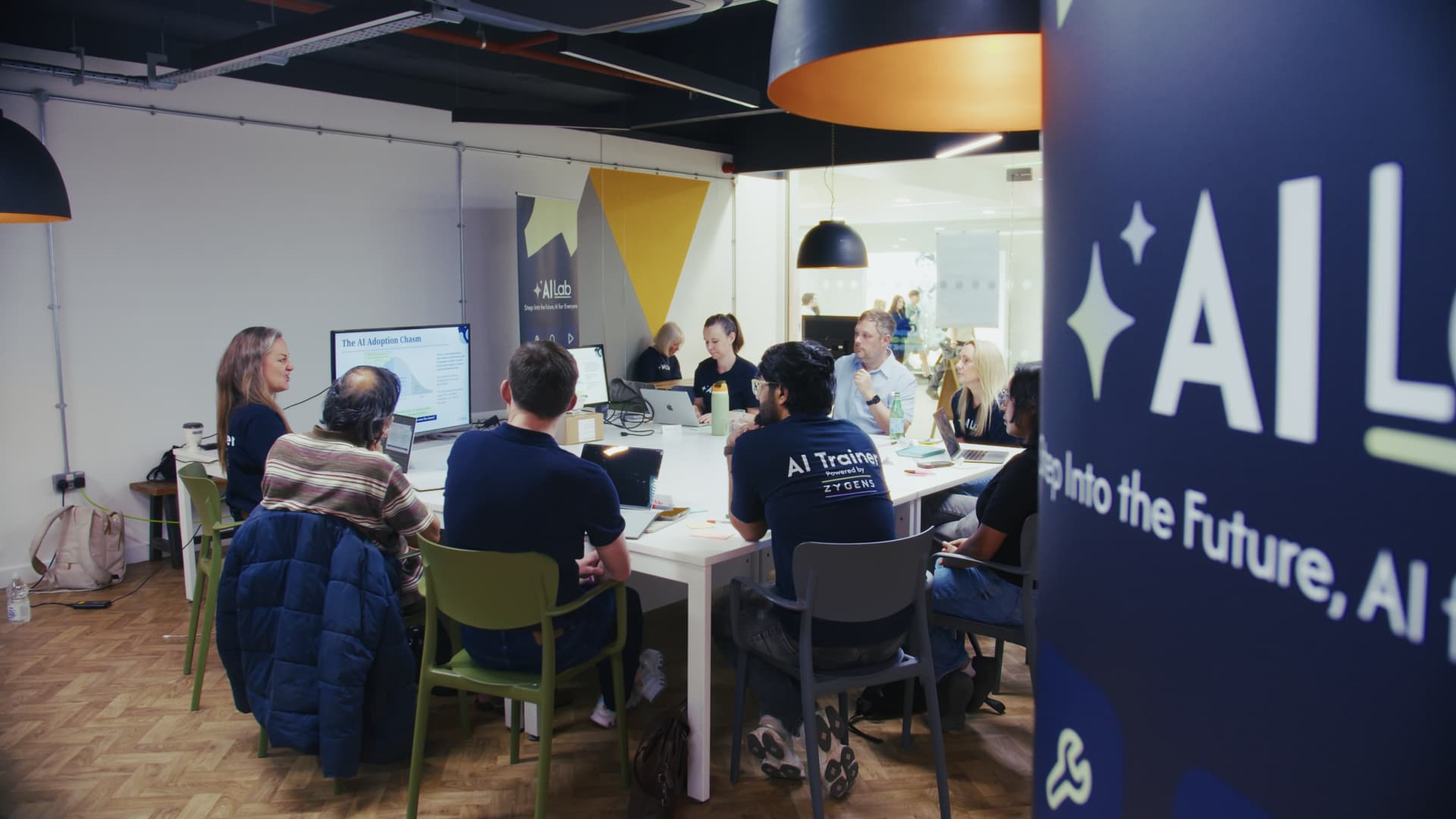 A hands-on AI Lab session with laptops and a presentation on AI adoption