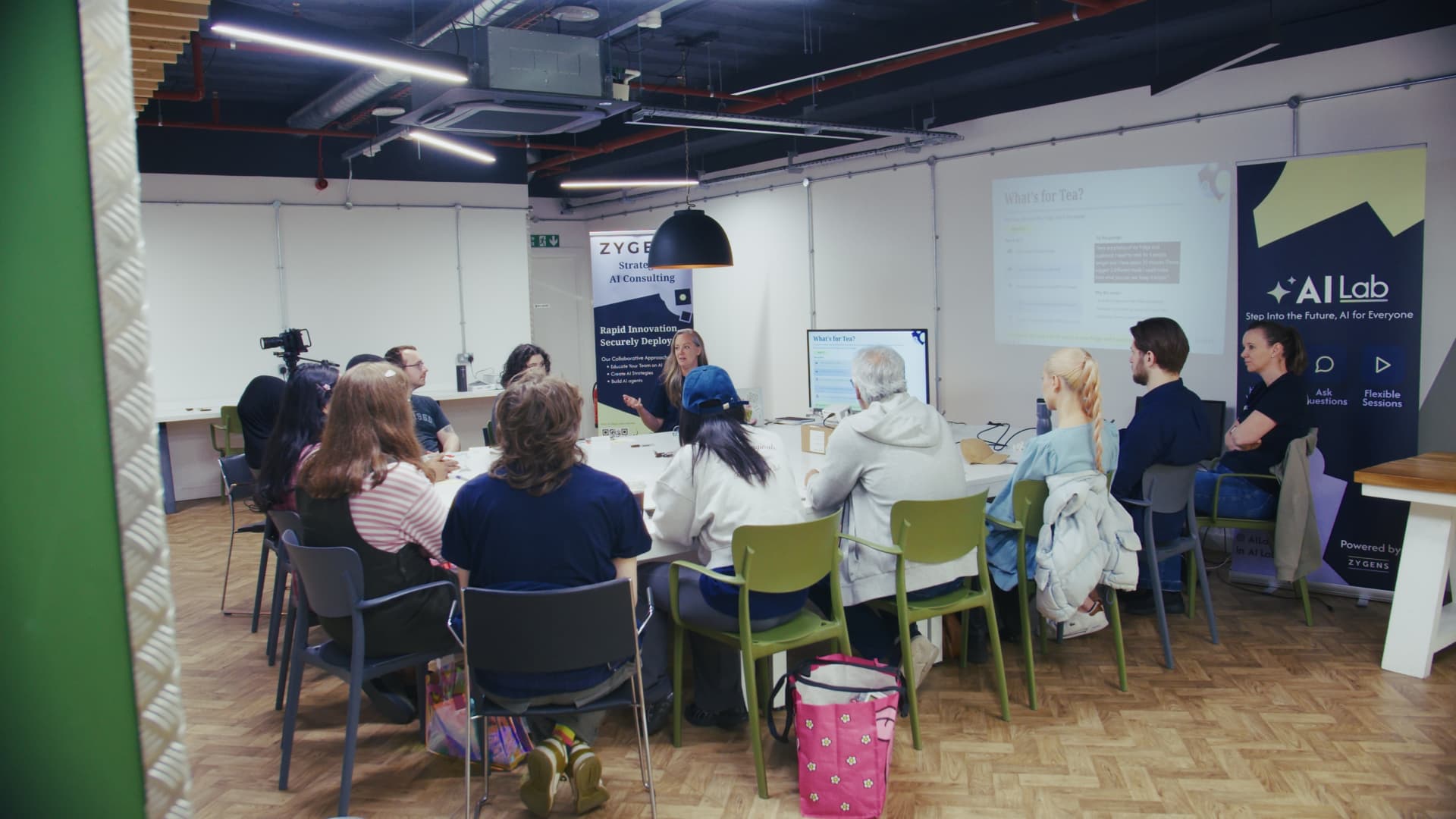 Attendees seated around a large table at an AI Lab workshop in Leeds